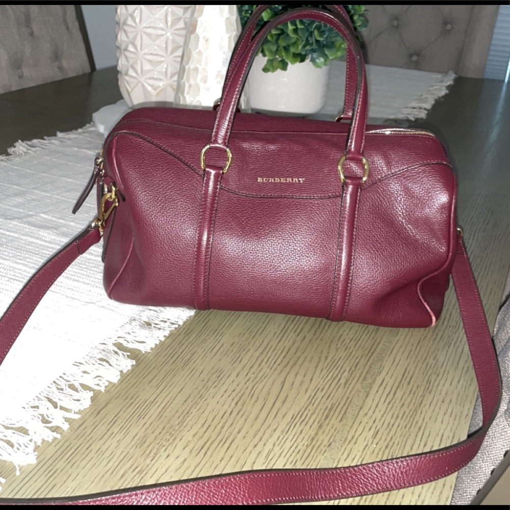 Plum Burberry strap bag.